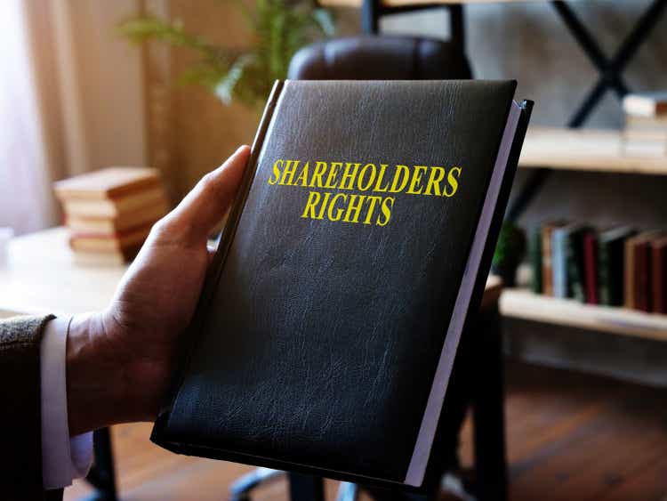 Advisor demonstrates the shareholders rights book.