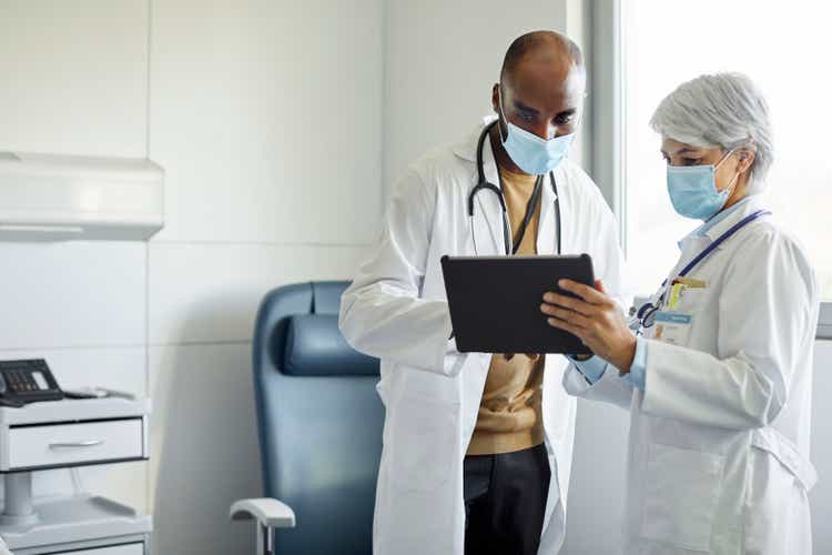 Medical workers with digital tablet in hospital