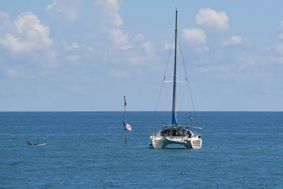 A catamaran sits near the historic S.S. Breconshire shipwreck in Vero Beach where people snorkel on Monday, Sept. 5, 2022.