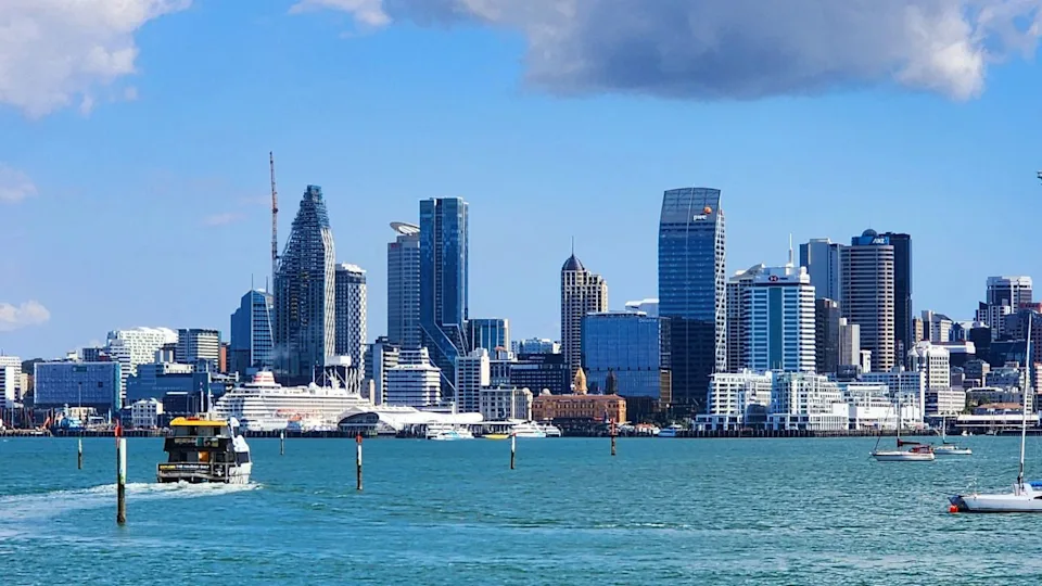 Auckland, New Zealand - 13 February 2025: Bayswater Wharf Overlooking Auckland Skyline. A stunning waterfront view capturing the serene beauty of Bayswater Wharf with Auckland’s iconic skyline.