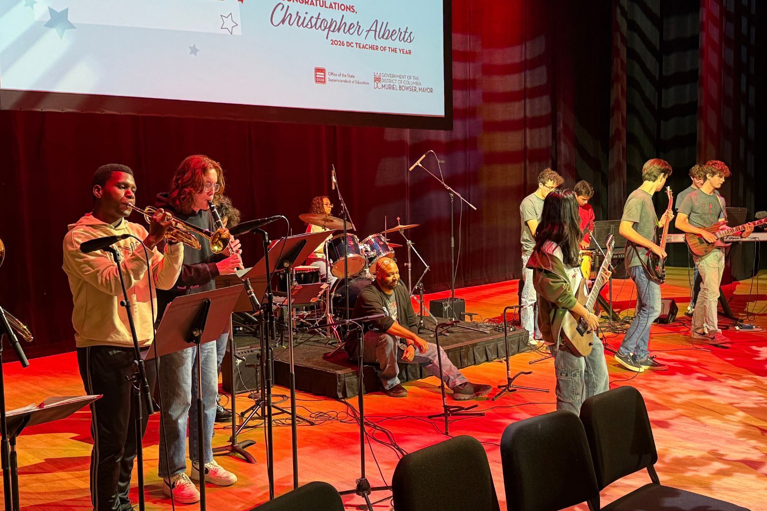 Christopher Alberts' students perform song on stage