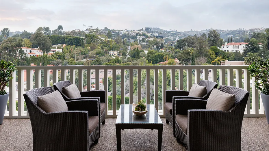 A terrace with two chairs.