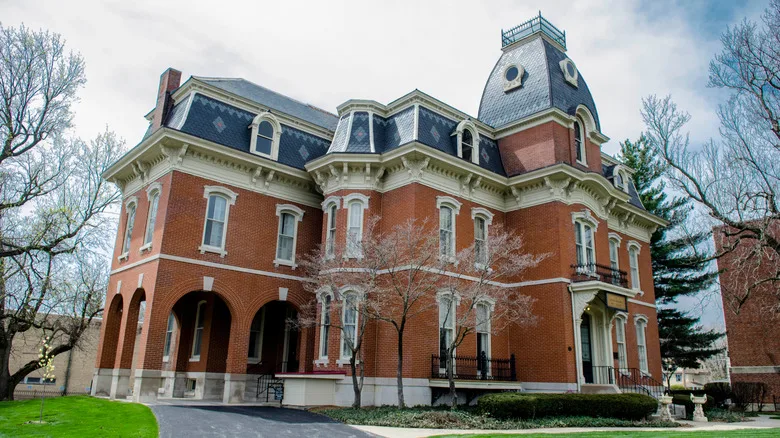 Brick historic house with black roof