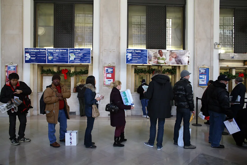 Line of customers in a post office in New York City in December 2007.