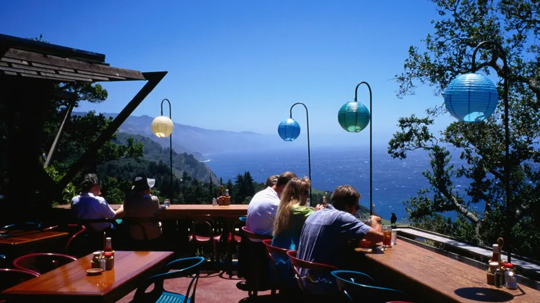 Diners enjoy a meal on the terrace - Nepenthe Restaurant, Big Sur, CA